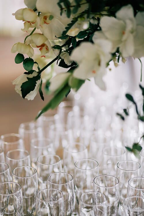 Floral Bouquet and Toasting Flutes for Wedding Reception